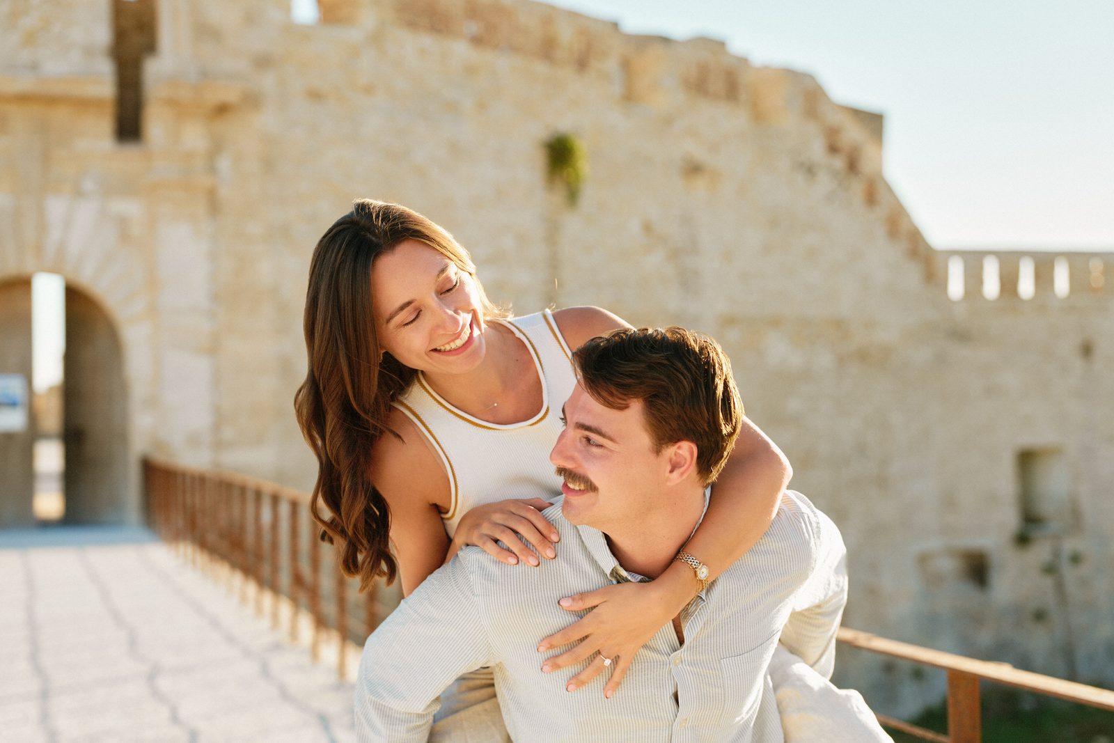 Piggyback on the seafront of Ortigia, by the old stone walls