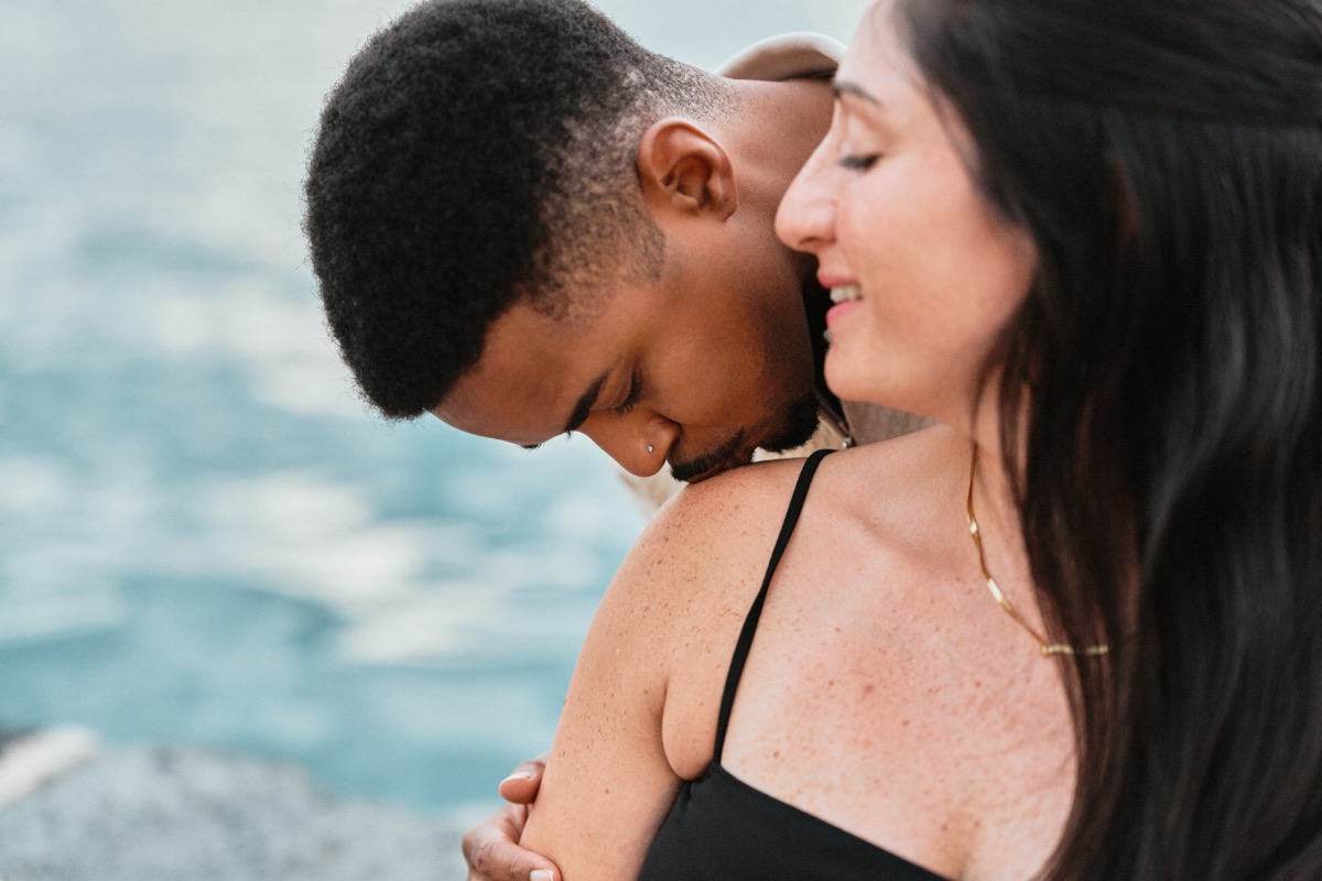 Close-up couple photo by the sea in Ortigia after the proposal